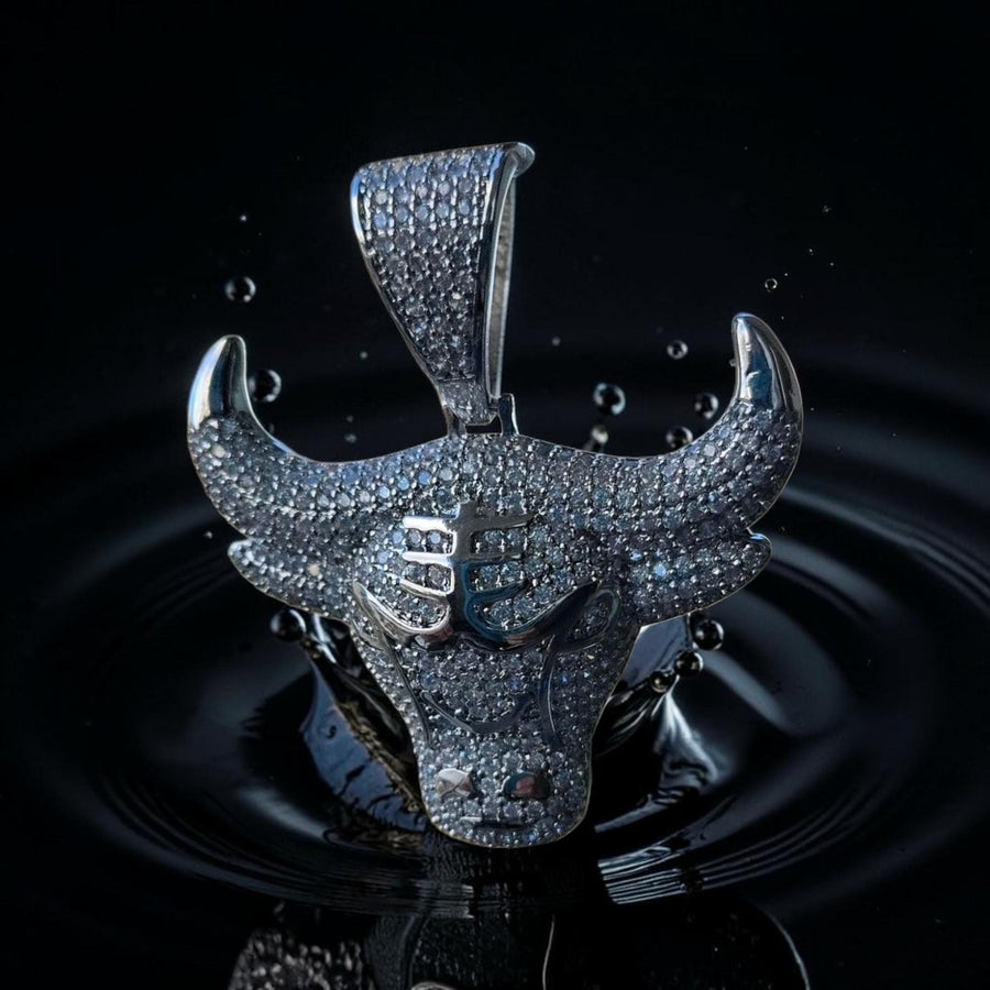 Iced out white gold filled bull pendant with 5 grade cz hand cut.